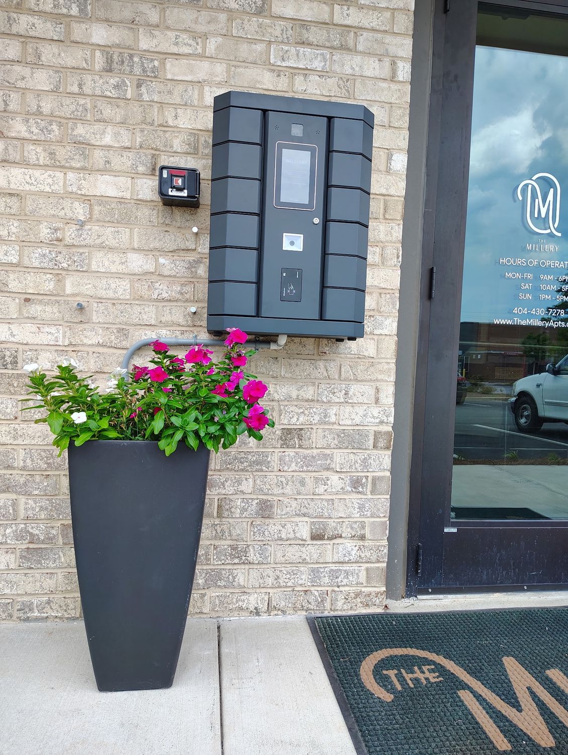 Pineapple kiosk installed beside a leasing office entrance