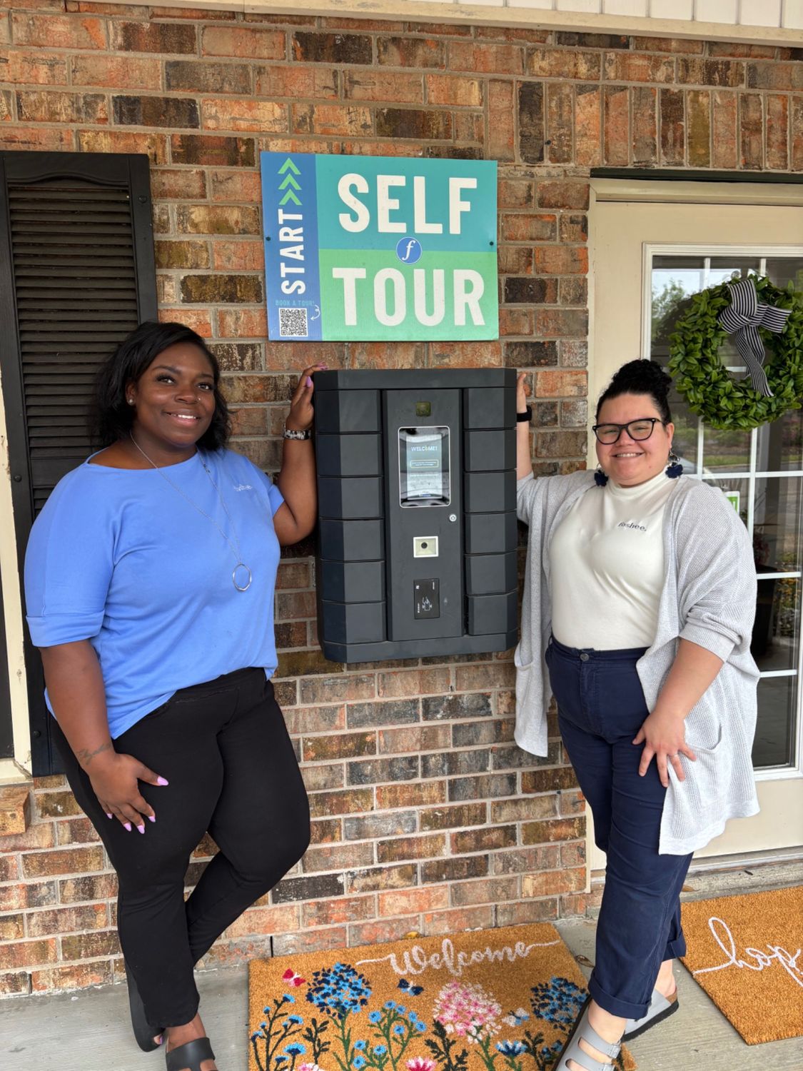 Liz and Taylor of Windsor Place Apartments with their Pineapple kiosk